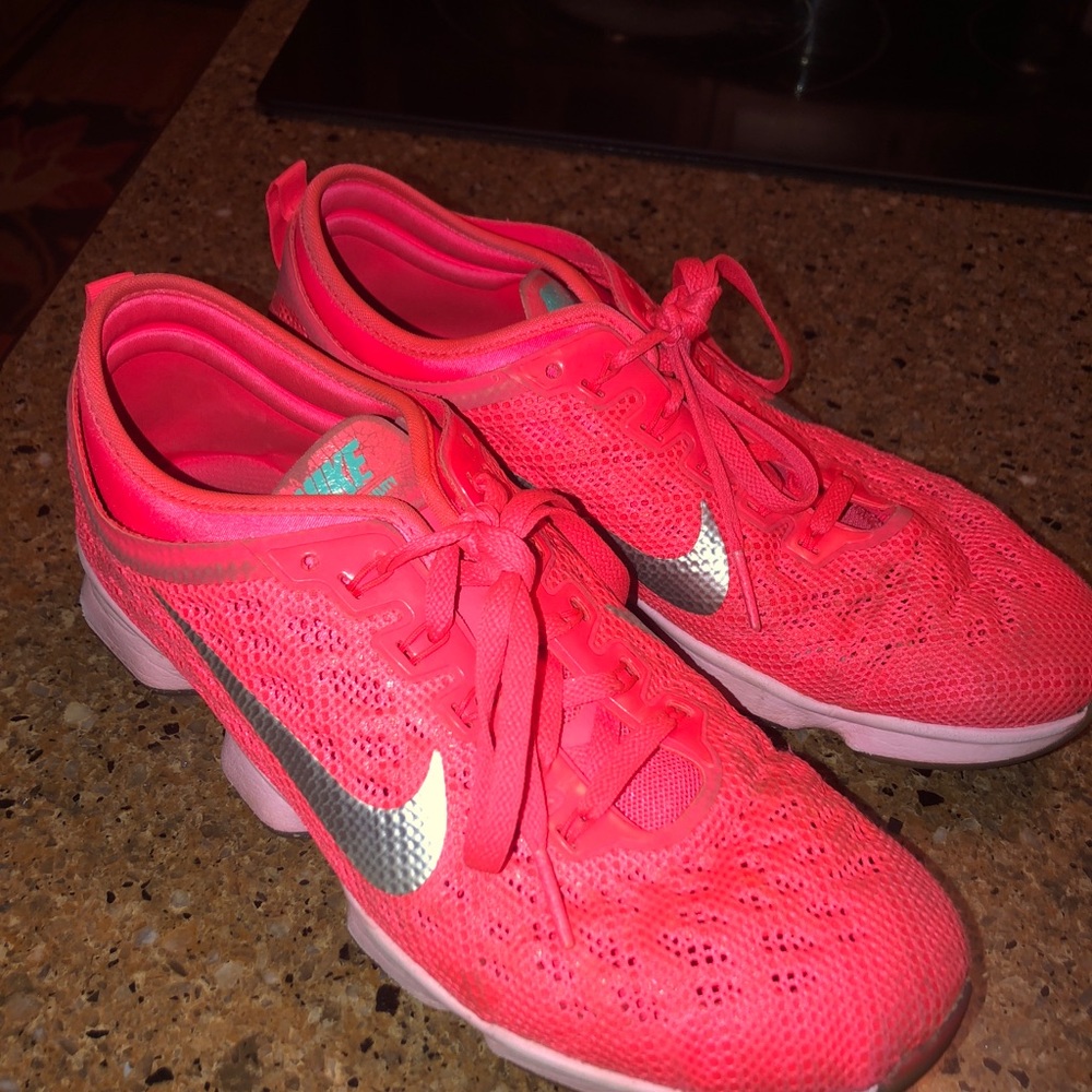 Coral Nike zoom athletic shoes